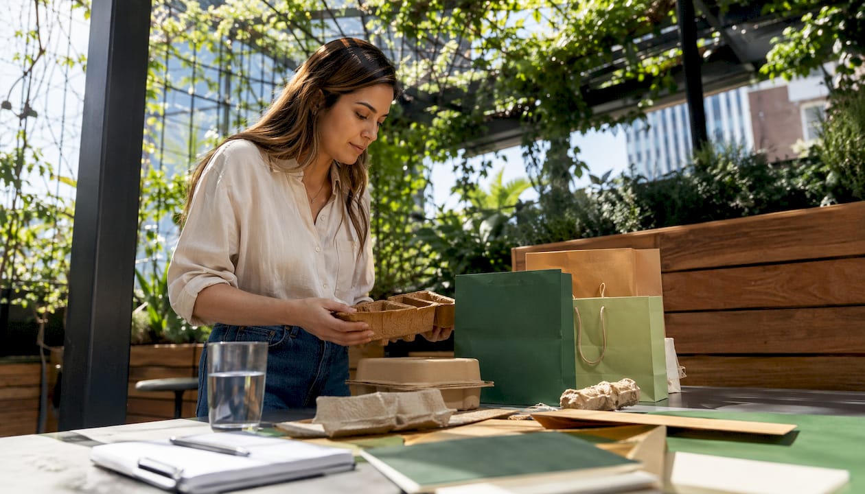 Brand manager reviewing eco-friendly packaging samples