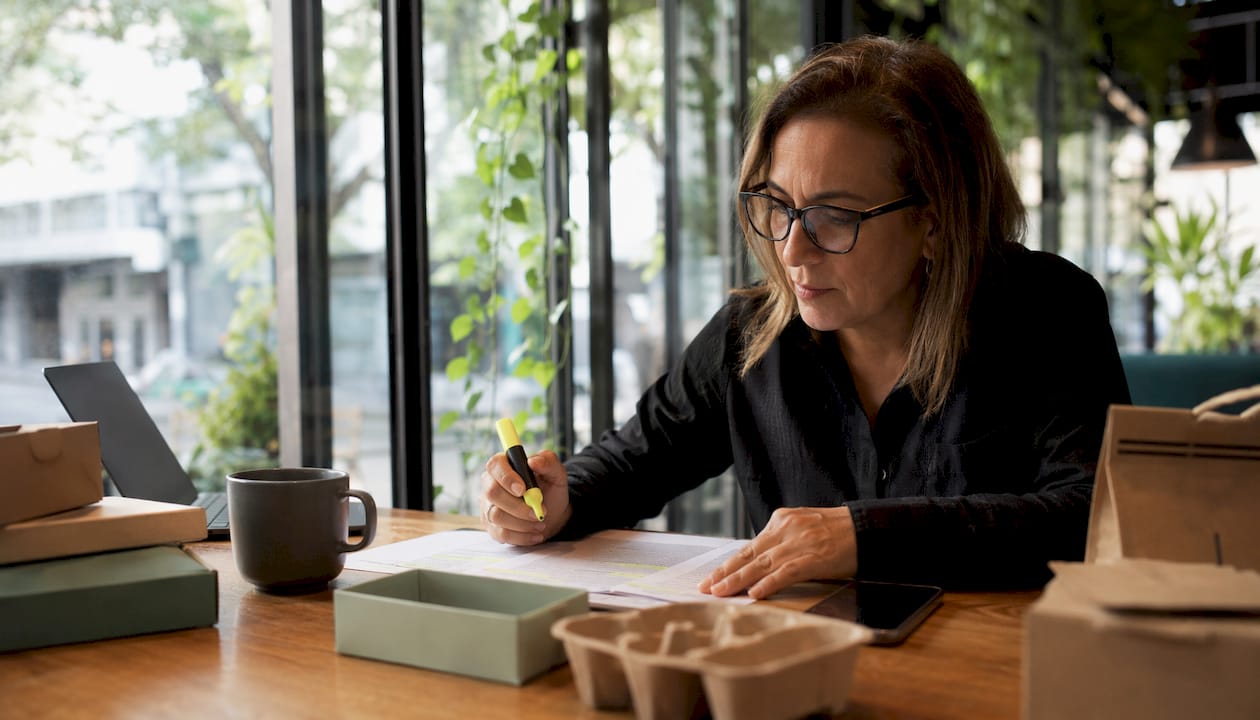 Procurement manager reviewing packaging certification documents